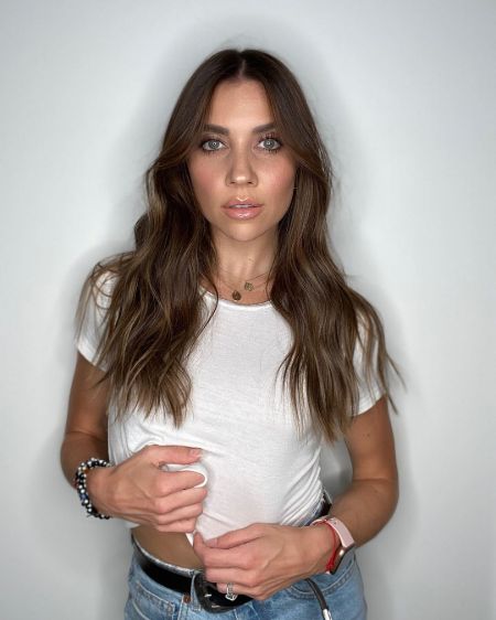 Jenna Johnson poses a picture in a white t-shirt,